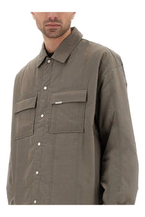 Represent men’s quilted overshirt in muted olive green with long sleeves button-up front and two chest pockets