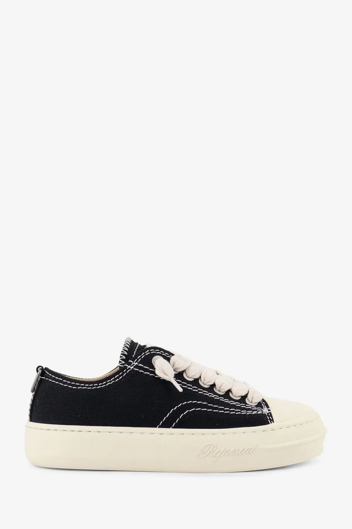 Represent men’s rep cap canvas sneakers black with black canvas, white laces, contrasting stitching, and cream rubber sole