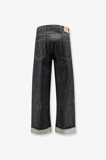 Dark-wash wide-leg denim jeans with rolled cuffs light stitching and beige leather brand tag represent men’s selvedge denim shirt black