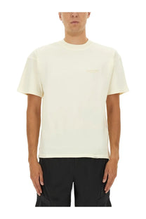 Represent men’s beige crewneck t-shirt in cream with minimalist design and subtle embroidered logo on the chest