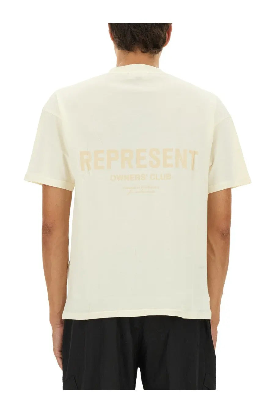 Represent men’s beige cream short-sleeved t-shirt with faded gold represent graphic and smaller text below printed front