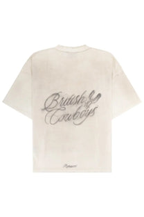 Cream-colored oversized represent men’s t-shirt with british cowboys embroidered in silver thread on the back
