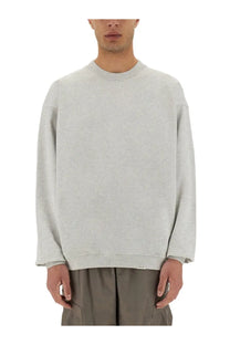 A light gray oversized crewneck sweatshirt by represent men with soft cotton texture and subtle ribbed cuffs