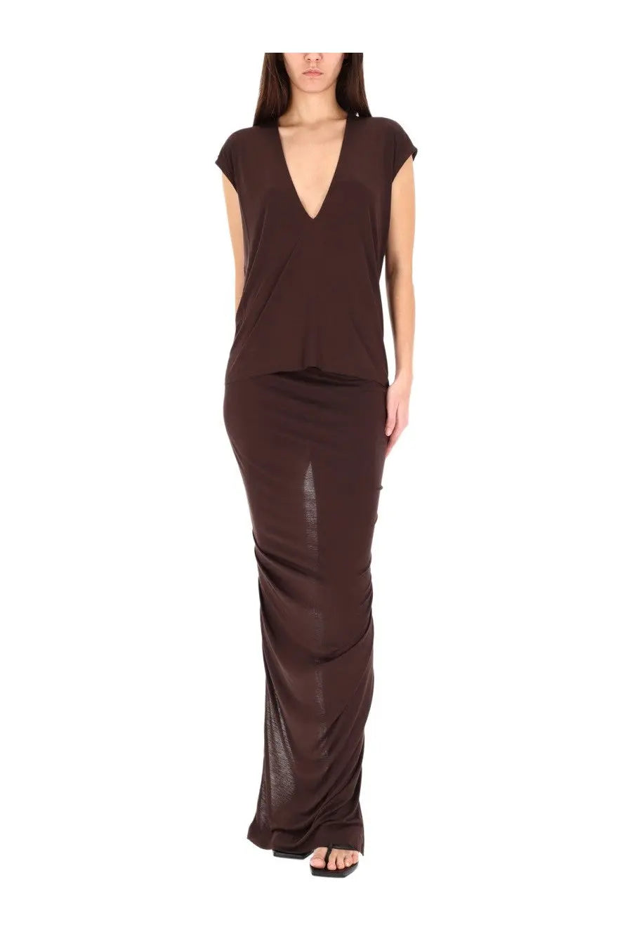A sleek chocolate-brown two-piece outfit by Rick Owens Lilies featuring a loose v-neck top and sheer-paneled maxi skirt