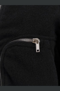 A sleek silver zipper with a metallic pull tab on the black virgin wool rick owens men’s bauhaus flight bomber jacket