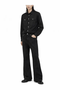 Black long-sleeved button-up shirt with two chest pockets and white buttons complementing Rick Owens men’s Bolan bootcut pants black
