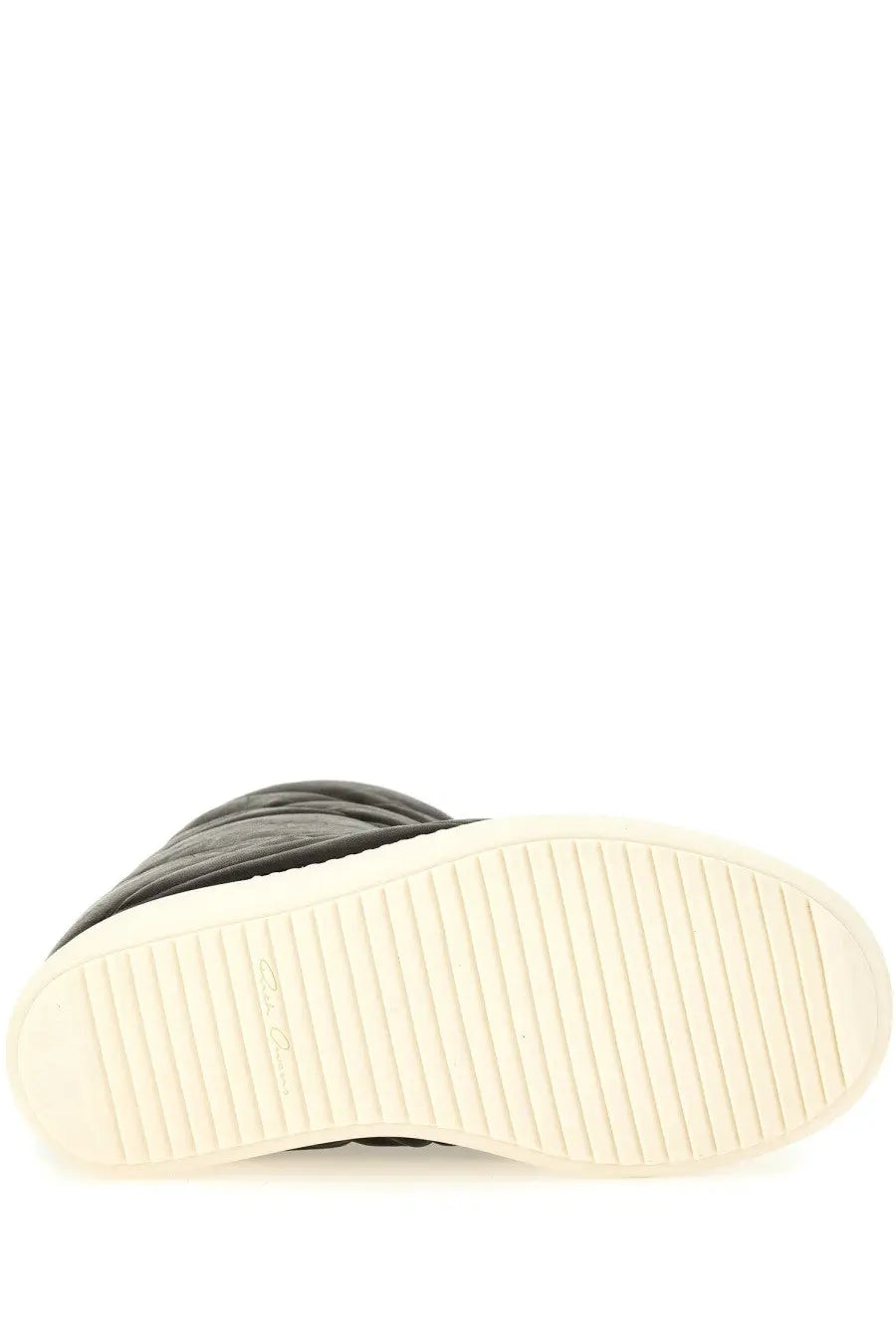 Back view of rick owens men’s boot mega bumper lunar black quilted high-top sneaker with white grooved sole and logo heel