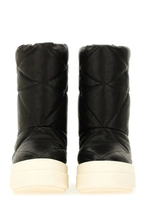 Rick Owens men’s quilted black winter boots with cream platform sole designed for cold weather use