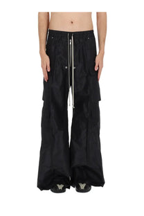 Rick Owens men’s black cargo belas pants with wide-leg fit, drawstring waist, and silver zipper accents