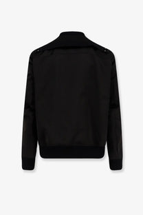 Rick Owens men’s classic flight bomber black jacket with high collar and subtle stitching details visible
