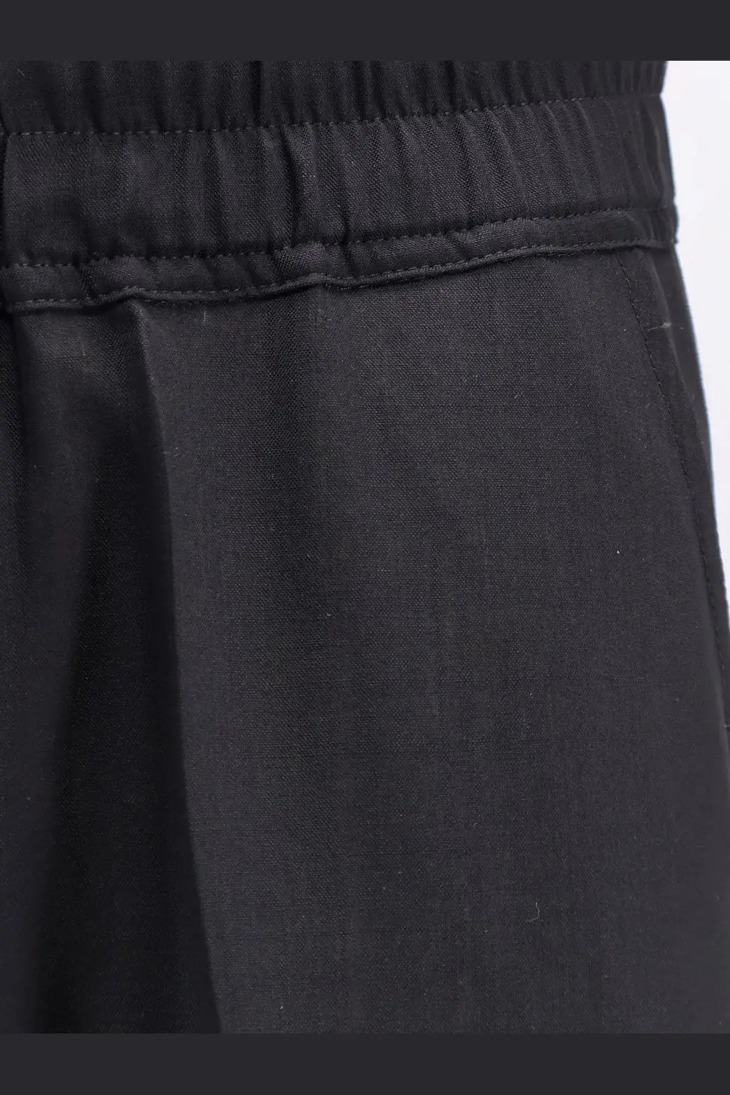 Rick Owens men’s black drawstring long trousers made of certified virgin wool with elastic waist and subtle stitching details