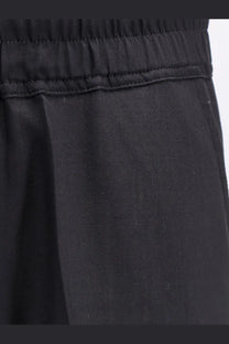 Rick Owens men’s black drawstring long trousers made of certified virgin wool with elastic waist and subtle stitching details