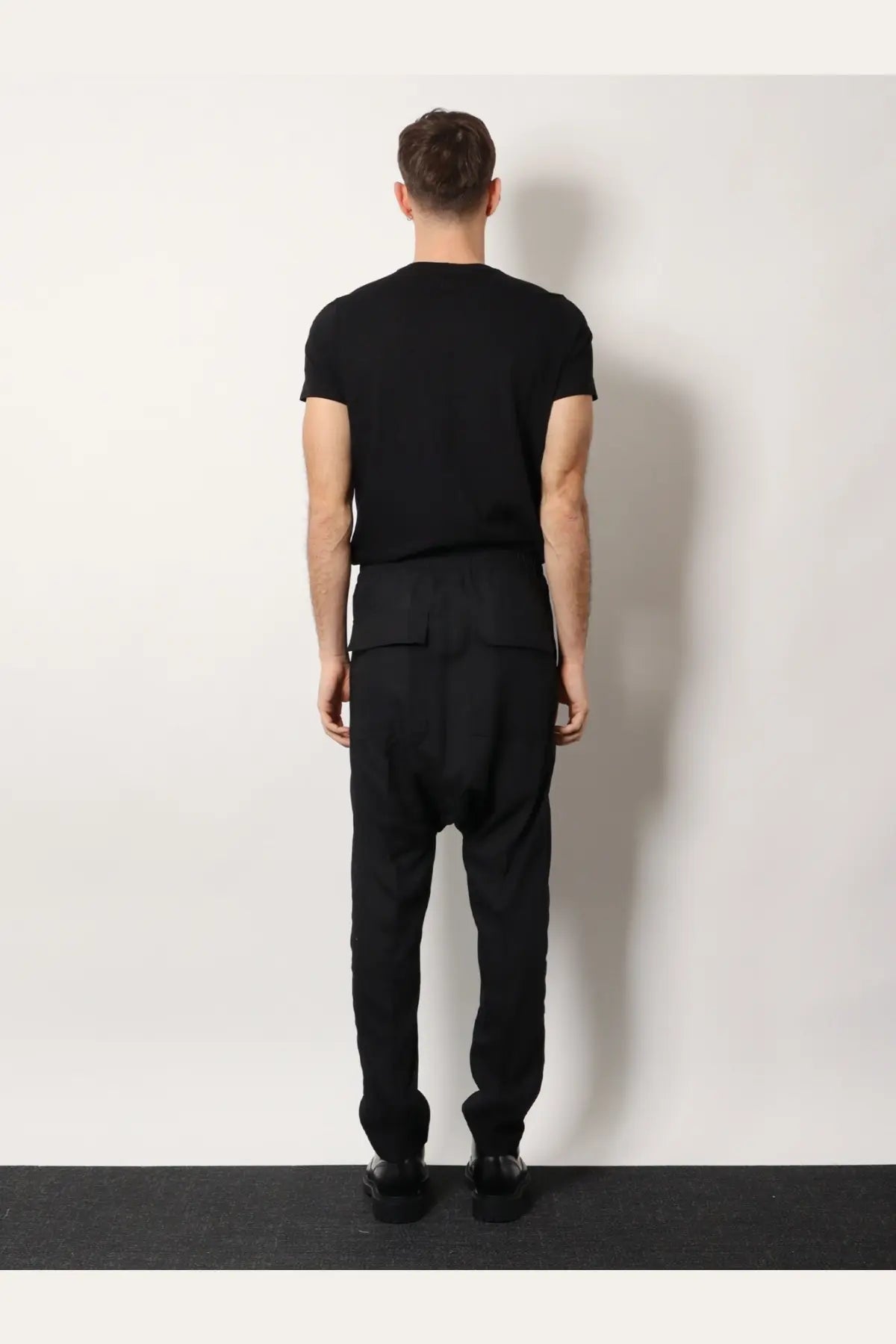 Rick Owens men’s black drawstring long trousers in certified virgin wool with tailored fit and two front pockets