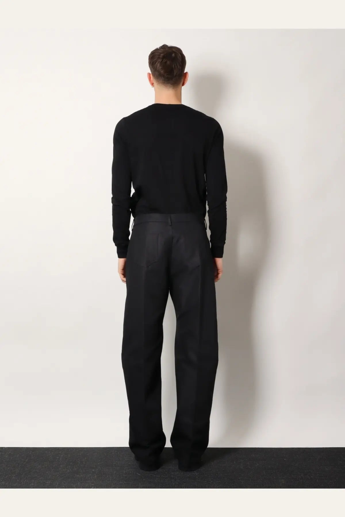 Black minimalist wide-leg rick owens men geth certified cotton blend trousers with sleek tailored fit