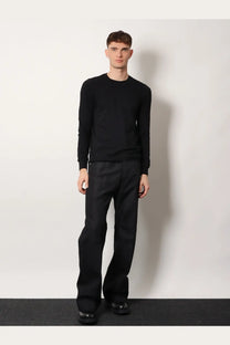 Black long-sleeved crewneck sweater paired with Rick Owens men’s geth certified cotton blend trousers black
