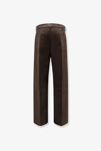 Rick Owens men’s brown wide-leg trousers with a sleek tailored fit and subtle front pockets made from recycled material