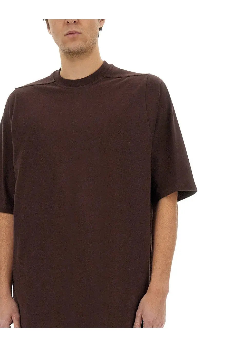 Rick Owens men’s jumbo shirt in brown features a dark brown oversized short-sleeved relaxed fit with subtle seam detailing
