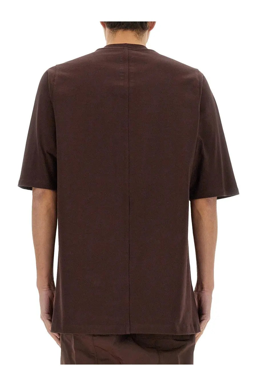 Back view of a rick owens men’s jumbo dark brown short-sleeved shirt with straight cut and vertical seam detail