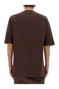 Back view of a rick owens men’s jumbo dark brown short-sleeved shirt with straight cut and vertical seam detail
