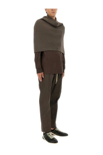 Rick owens men’s knitted cape grey shown with a dark brown ribbed knit cowl neck poncho layered over matching knitwear