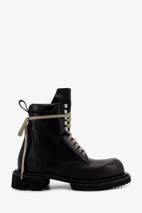 Rick Owens men’s black leather combat boot with contrasting beige laces and silver eyelets