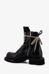 Rick Owens men’s black leather combat boot with beige laces and side zipper for easy wear