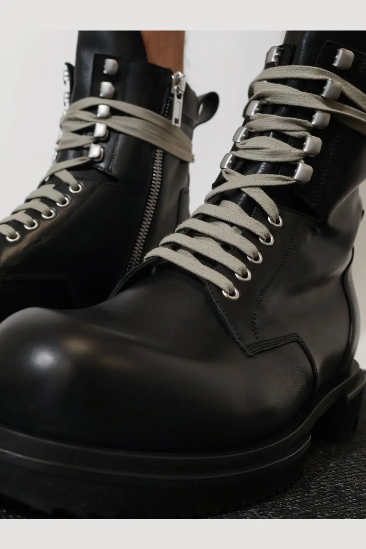 Rick Owens men’s black leather combat boots with chunky sole silver eyelets laces and side zipper detail