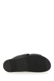 Black rubber sole with parallel ridges for grip on rick owens men’s leather slide sandal black