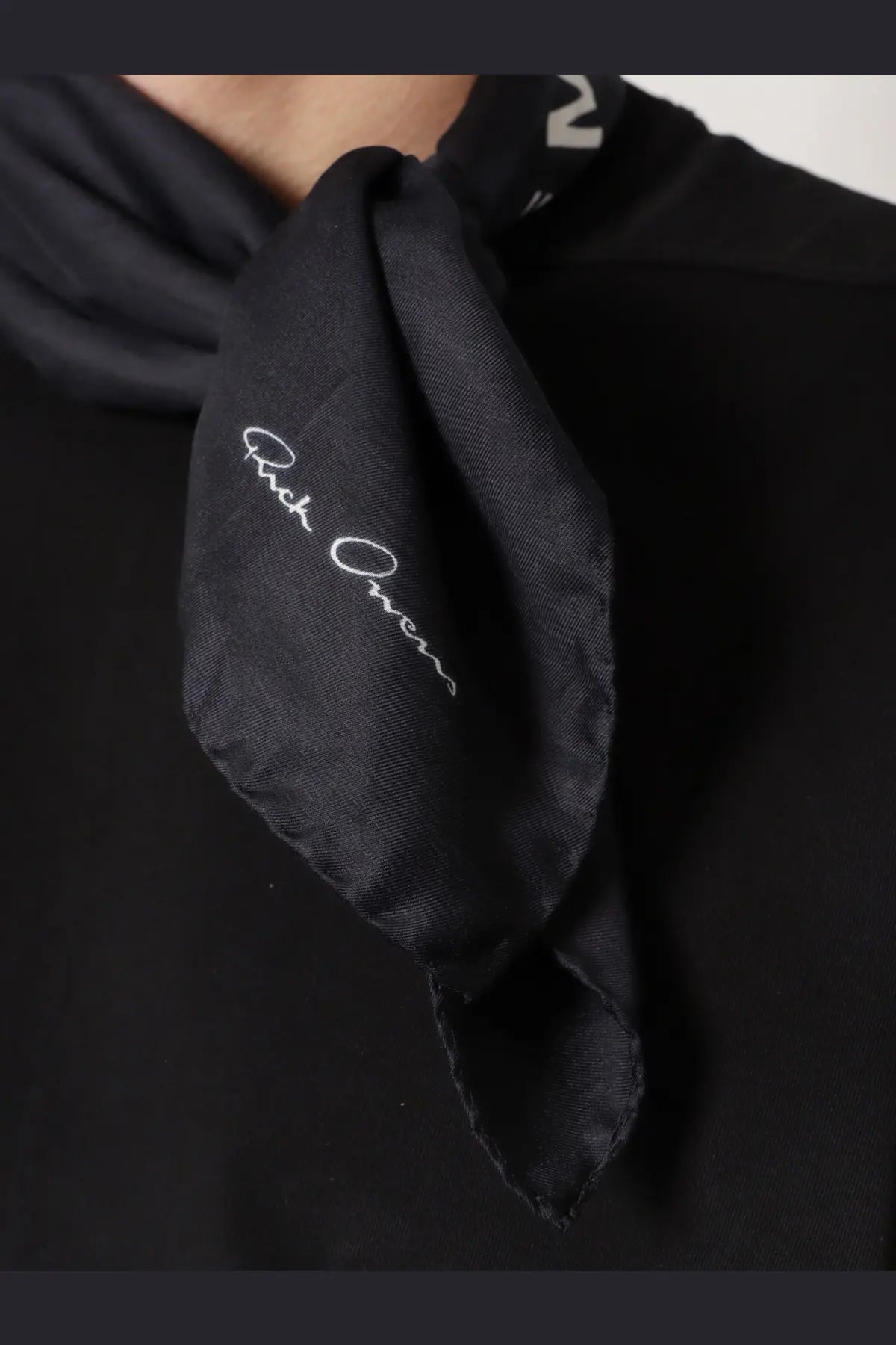Black silk scarf with white embroidered rick owens signature from the men’s modal and silk blend collection