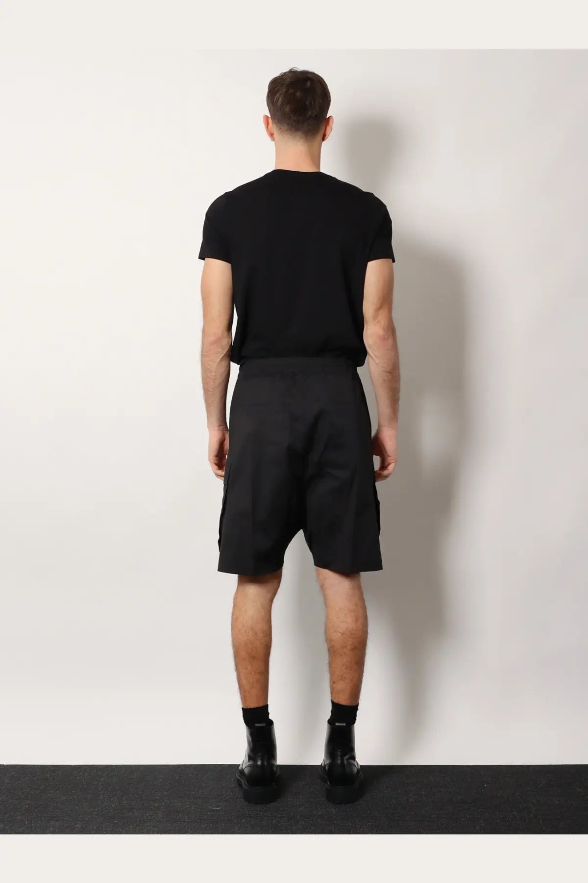 Rick Owens men’s black organic cotton cargo shorts with relaxed fit and multiple side pockets