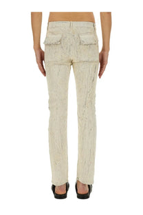 Rick Owens men’s beige distressed denim pants with textured worn-in appearance and two front pockets