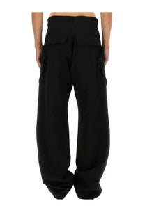 Rick Owens men’s Stefan cargo pants in black featuring wide-leg design, large cargo pockets, and structured waistband