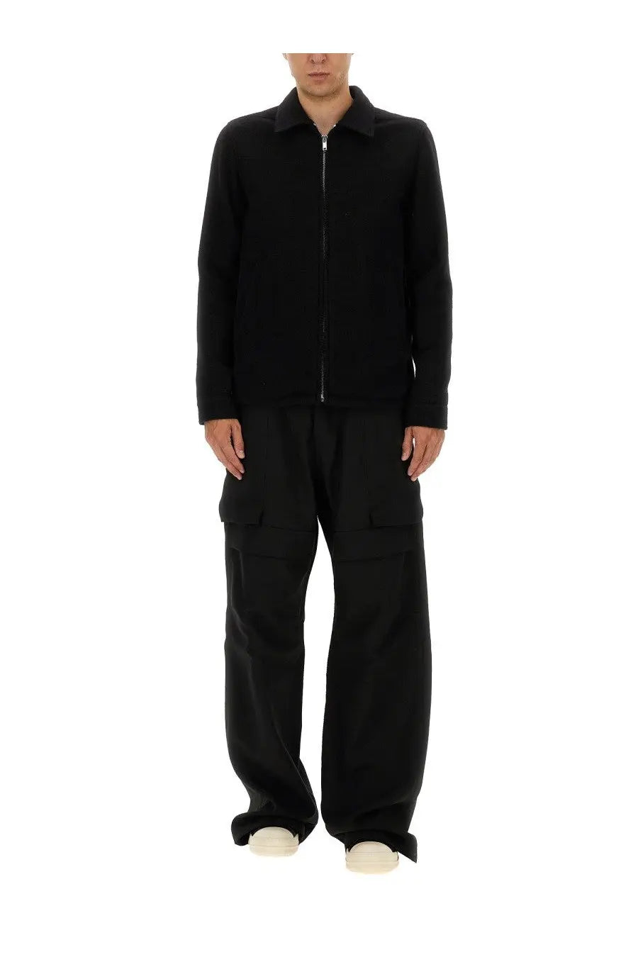 Black zip-up jacket with collar and long sleeves paired with rick owens men’s stefan cargo pants black