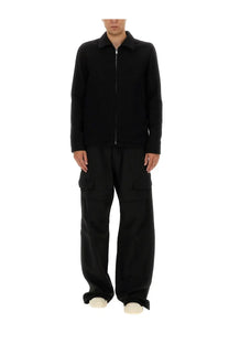 Black zip-up jacket with collar and long sleeves paired with rick owens men’s stefan cargo pants black