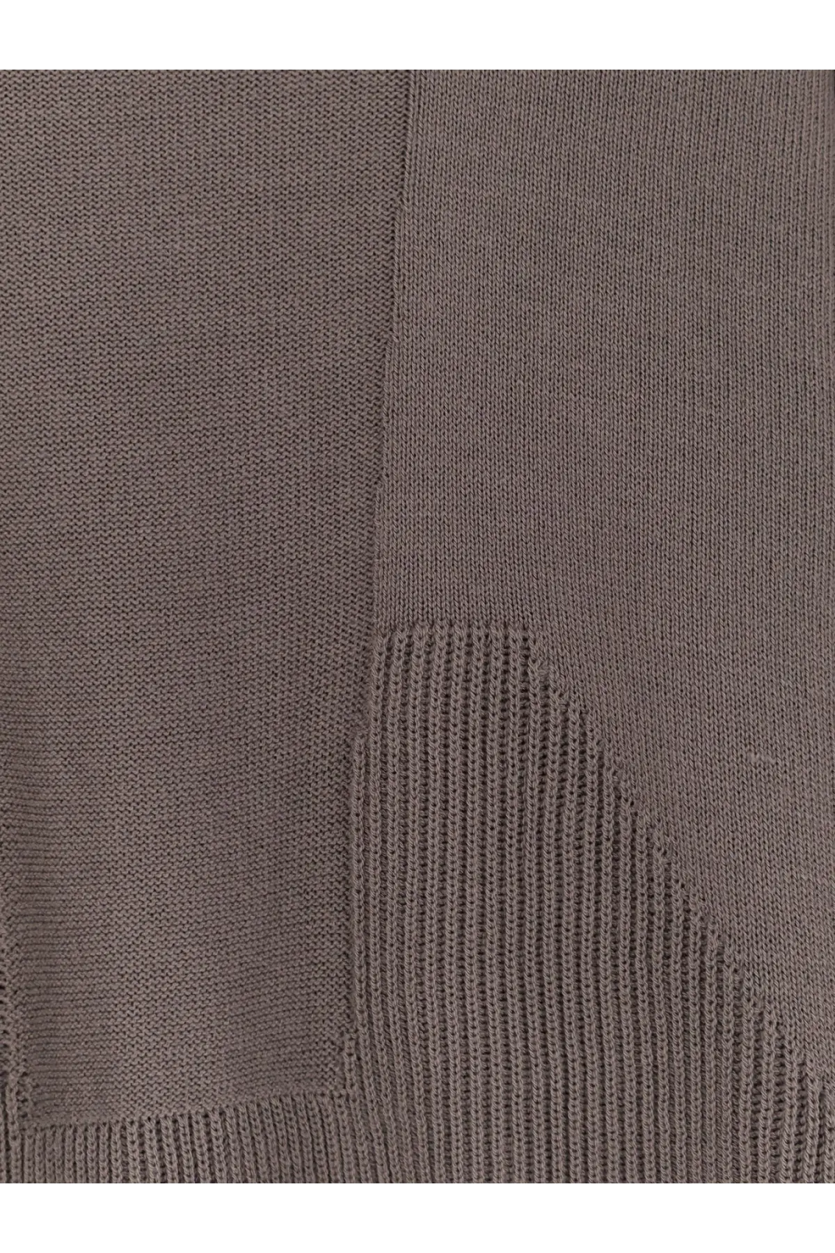 A close-up of a taupe ribbed texture on the rick owens men’s virgin wool sweater grey showing subtle seam detail