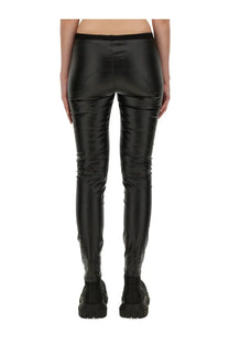 Rick Owens women’s denim leggings in black patent leather with a sleek glossy finish and subtle seam detailing