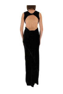 Back view of a rick owens women’s black velvet gown with a dramatic open back and crossed shoulder straps