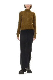 Olive-green textured knit turtleneck sweater with long sleeves paired with rick owens womens black knit skirt
