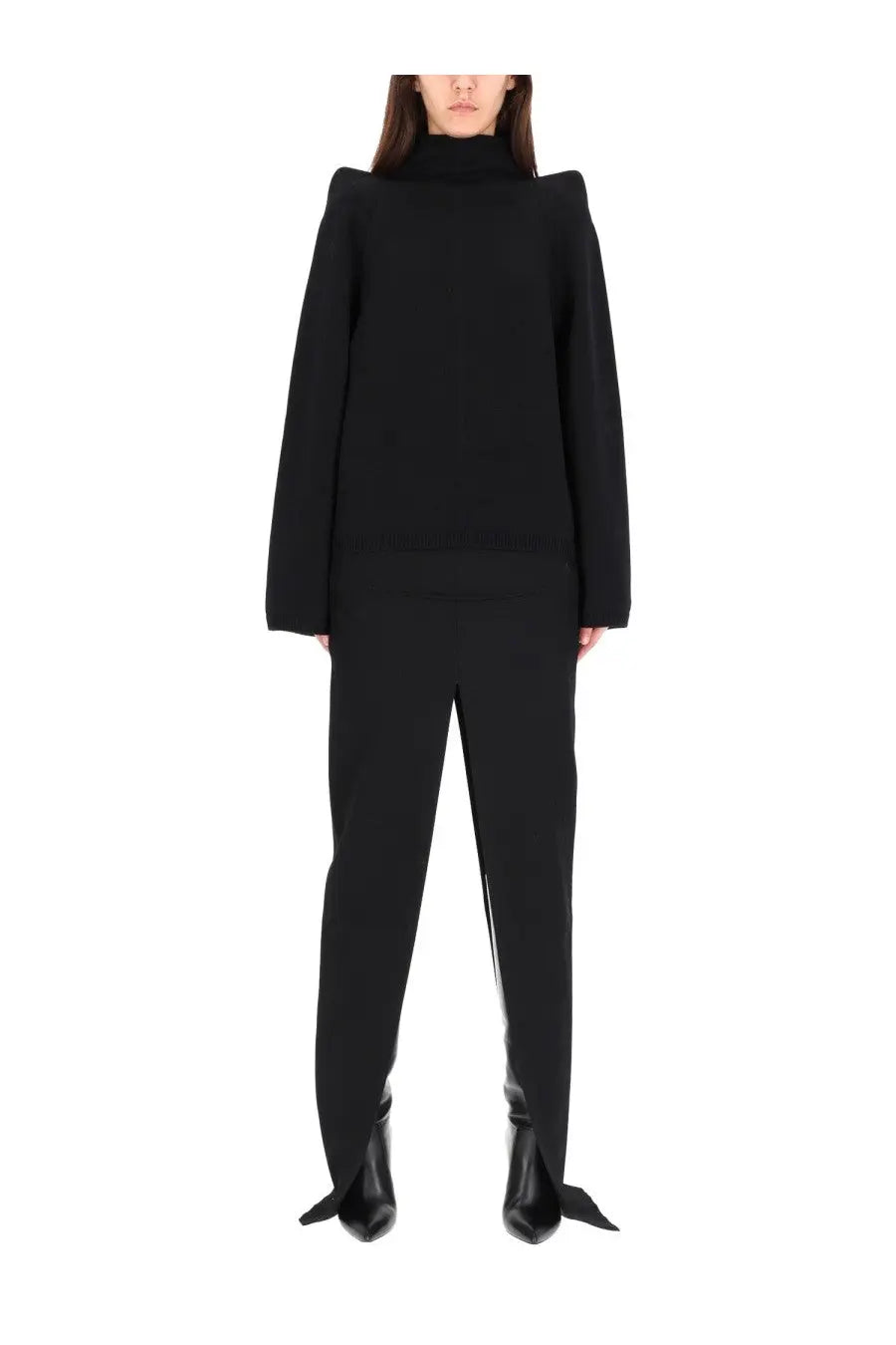 Black oversized turtleneck sweater with structured shoulders and long sleeves paired with rick owens black long skirt
