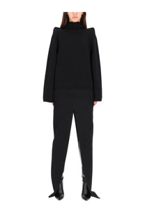 Black oversized turtleneck sweater with structured shoulders and long sleeves paired with rick owens black long skirt
