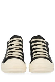 Rick Owens women’s low sneakers in black with cream-colored laces and a thick off-white rubber sole