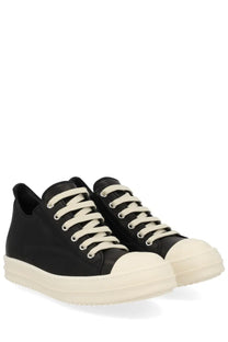 Rick Owens women’s low sneaks sneaker in black with cream laces rubber toe caps and thick off-white sole