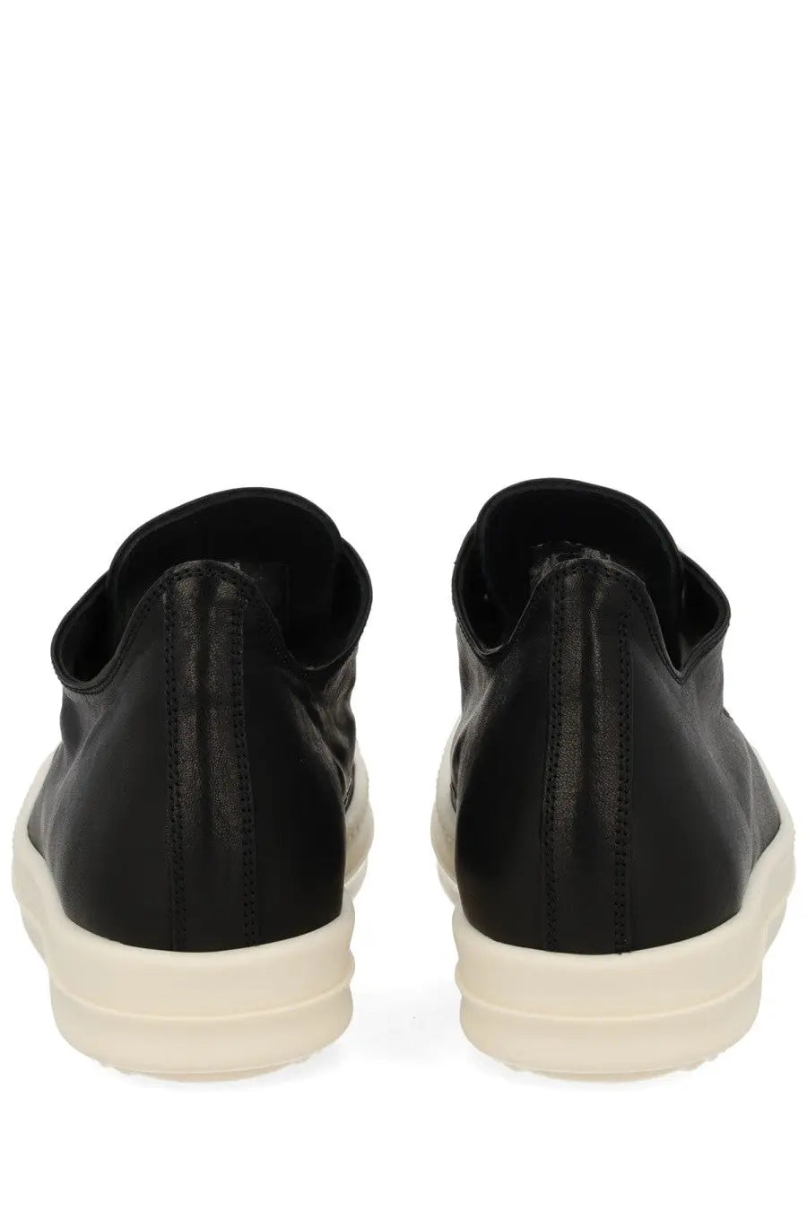 Rick Owens women’s low sneaks black leather slip-on sneakers with thick off-white rubber sole shown from the back