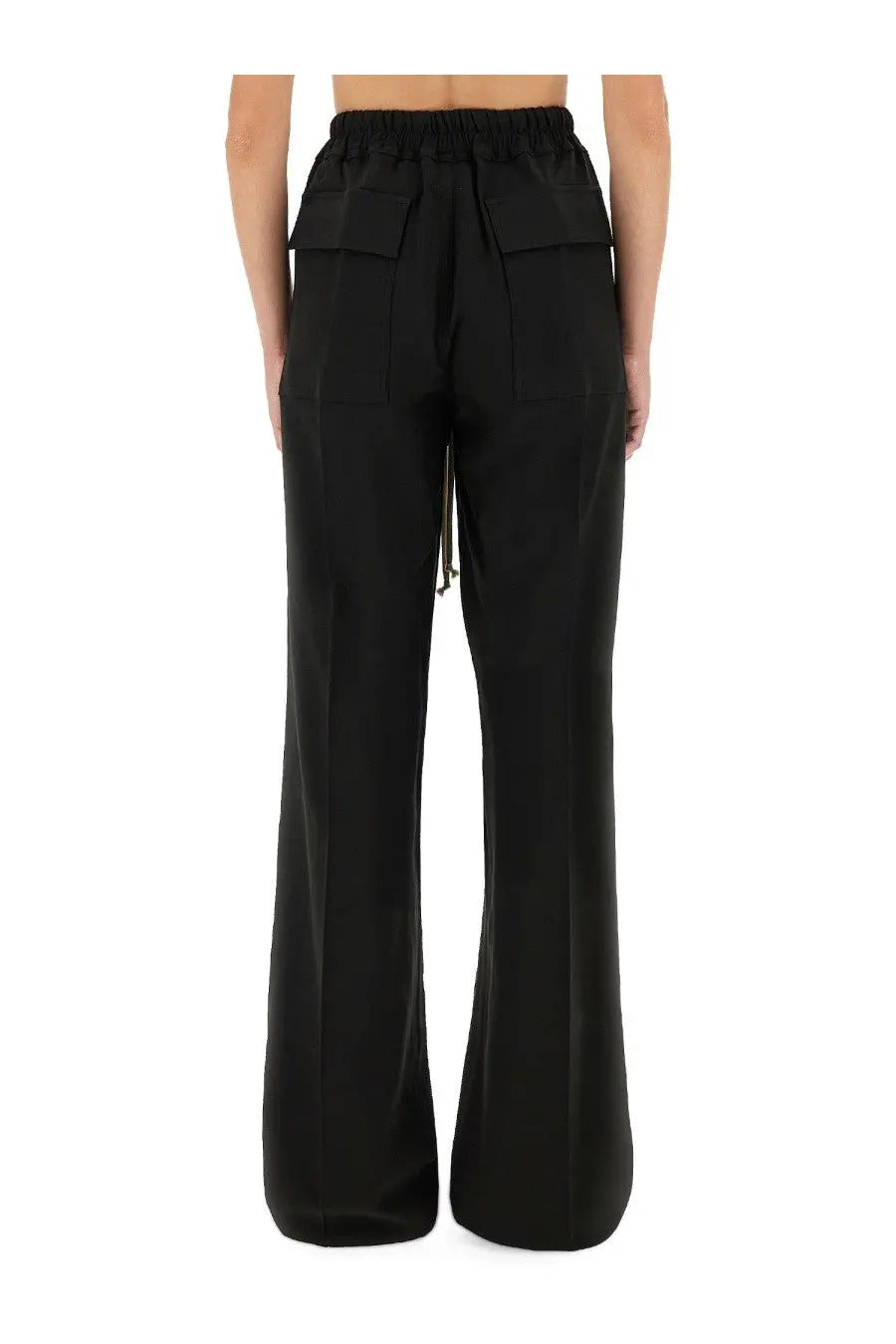 Back view of rick owens women’s black wide-leg pants with elastic waistband and large flap pockets