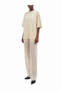 Cream-colored oversized short sleeve t-shirt with relaxed fit paired with Rick Owens women’s pink Dietrich pants
