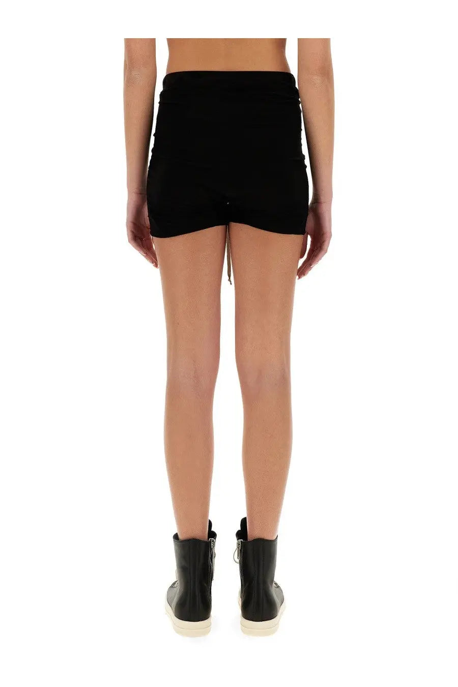 Black high-waisted rick owens women’s shorts with ruched back and side pockets shown from the back side