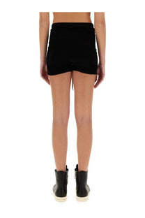 Black high-waisted rick owens women’s shorts with ruched back and side pockets shown from the back side