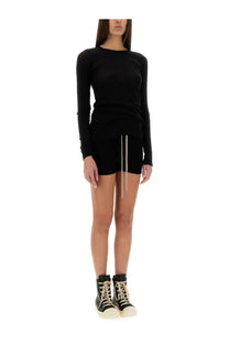 Rick Owens women’s black long-sleeved dress with drawstring hem paired with matching high-top sneakers