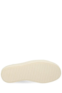 Cream-colored rubber sole with textured ribbed pattern on rick owens women vintage sneaks sneaker beige back side