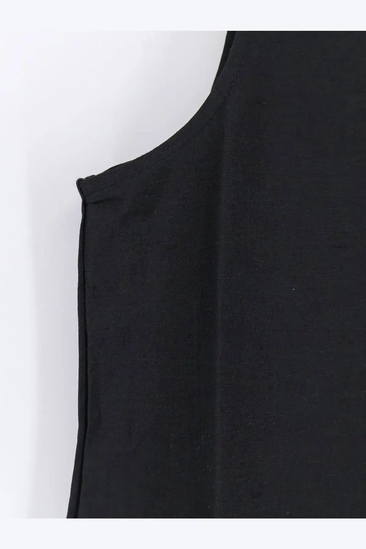 Black sleeveless top with smooth linen and silk blend fabric and clean shoulder seam stitching from rohe women’s hourglass dress